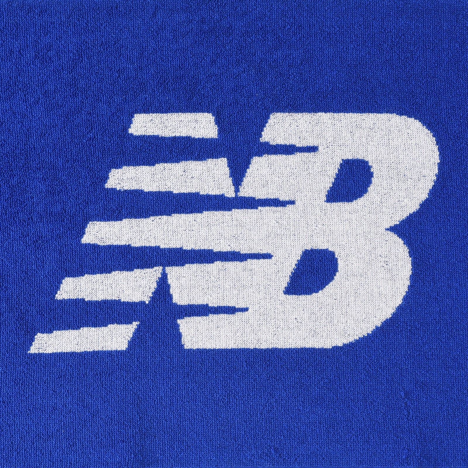 Jacquard face towel with big flying NB logo